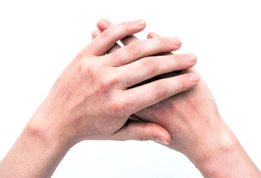 Two hands clasped together in a gesture of prayer or contemplation against clean white background