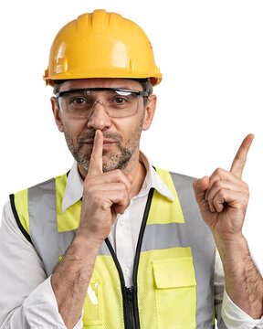 Middle aged male builder wearing safety equipment gesturing silence and pointing up with construction worker safety vest hard hat hush gesture silence sign protective equipment safety glasses