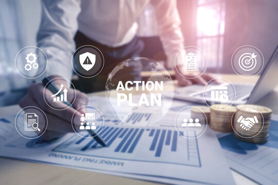 A professional drafts an action plan using graphs and strategic icons in a modern office, emphasizing teamwork and growth strategies for future success. Ledger
