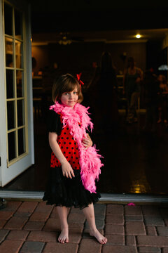 Little Girl in Dress with Feather Boa