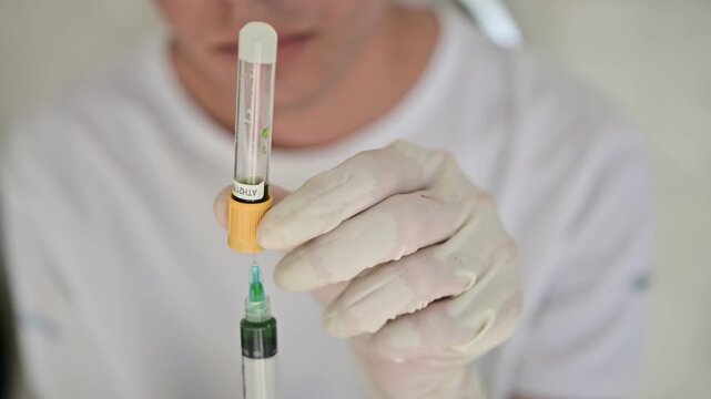 Human colostrum, the first breast milk produced after childbirth, a yellow to golden biological fluid rich in proteins, antibodies, immune factors, growth factors, vitamins, and nutrients

