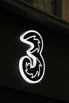 Copenhagen, Denmark - October 4, 2022: 3 company logo on a wall. Hutchison 3G Enterprises trading as 3 s the owner of several UMTS-based mobile phone networks and broadband Internet providers