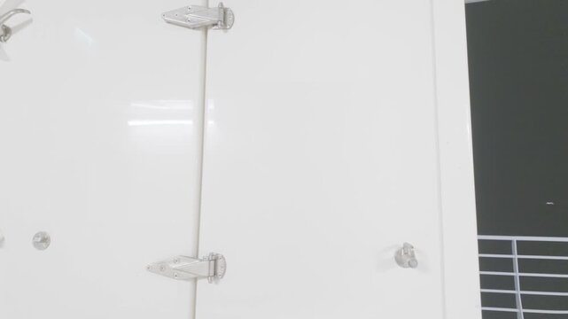 White Marine Storage Locker and Utility Compartment on Ship Deck