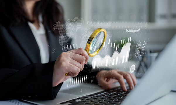 Business Analysis and Research on Data Trends Using Magnifying Glass and Laptop with Digital Graphs and Statistics Overlay in Office Setting. Entropy.