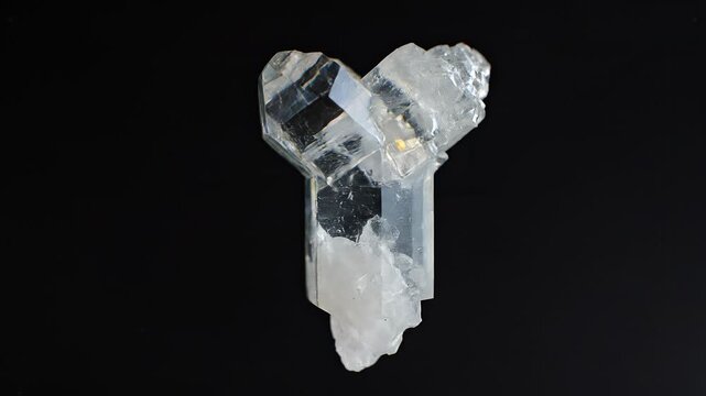 Spinning Translucent Geometric Crystal Mineral On Black Background