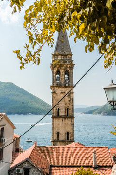 Bell tower and red rooftops in Perast Montenegro