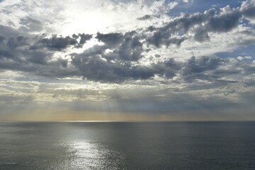 Jersey, U.K. Heavenly skies in Autumn over the Atlantic Ocean, shot from cliffs. © alagz