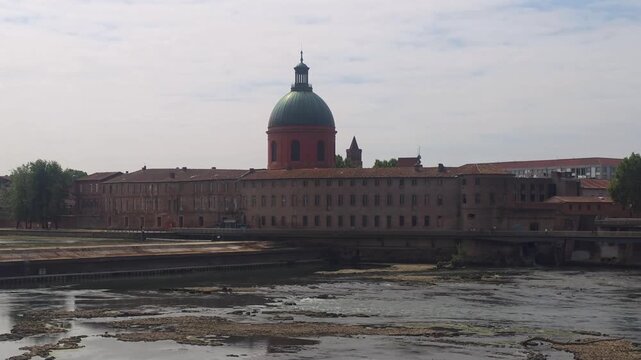 Historic La Grave Hospital and Dome Along the Garonne River in Toulouse, France