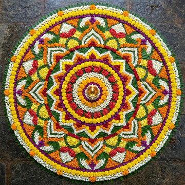 Happy Onam Festival Greeting with Traditional Kerala Pookalam and Brass Lamp