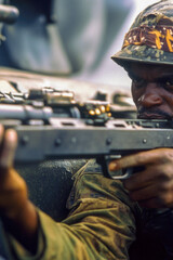 Obraz premium A soldier holding a machine gun, ready for action. vertical frame