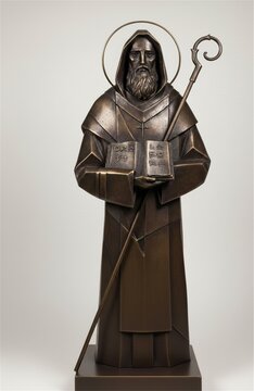 Monastic saint with book and crosier bronze statue