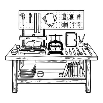 Bookbinding workbench with tools and equipment in a workshop

