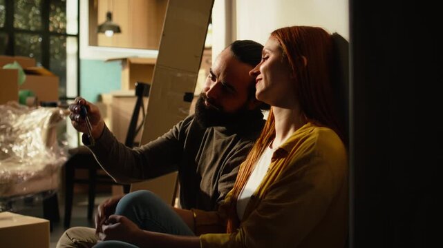 Homeowners hold new house keys after a property purchase, celebrating ownership, relocation and the satisfaction of beginning a fresh chapter together.