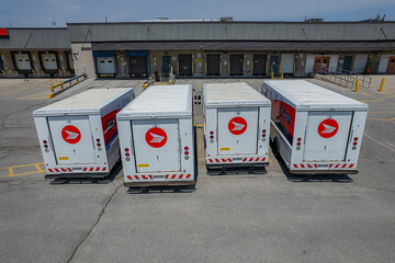 Obraz premium Canada Post delivery older step vehicle fleet. Canada’ Post is Canada's national postal service. The Crown corporation responsible for the delivery of mail: Toronto, Ontario, Canada - May 17, 2026