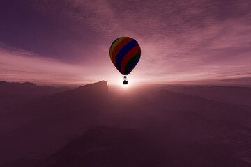 Fototapeta premium Colorful Hot Air Balloon Silhouette Floating Over Mountains At Sunrise With Dramatic Pink Sky