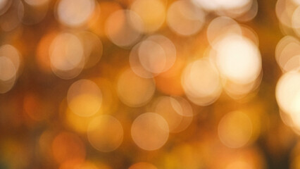 Fototapeta premium Warm golden autumn foliage bokeh background