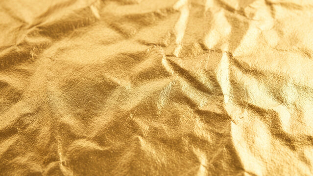 Soft crumpled golden foil texture background