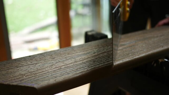 Man Makes Notch in Composite Deck Board
