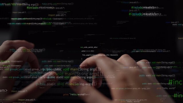 Close-up view of hands typing on a keyboard with a digital overlay of software code, symbolizing the essence of programming, data analysis, and technological innovation in a modern workspace. Xenic