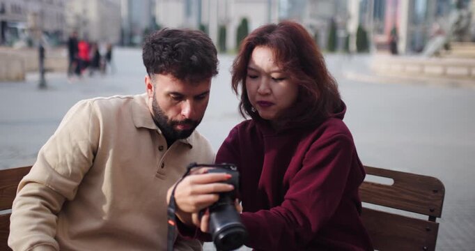 Friends Enjoying Coffee and Photography at an Outdoor Cafe in Bucharest, Romania