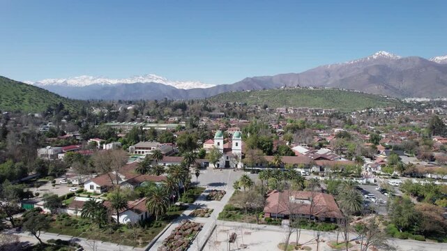 Aerial View of Los Dominicos Church with Andes Mountains in Santiago Chile - 4K