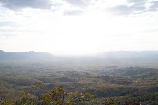 Panoramic view of vast misty valley and mountain ranges in Chapada dos Veadeiros Goias Brazil