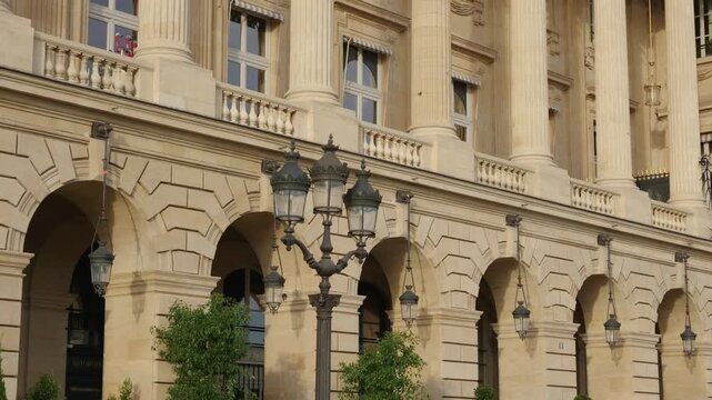 Place de la Concorde building arches and columns featuring a classic street lamp