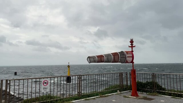Wind Sock Blows In Strong Tropical Storm Wind In Coastal Location