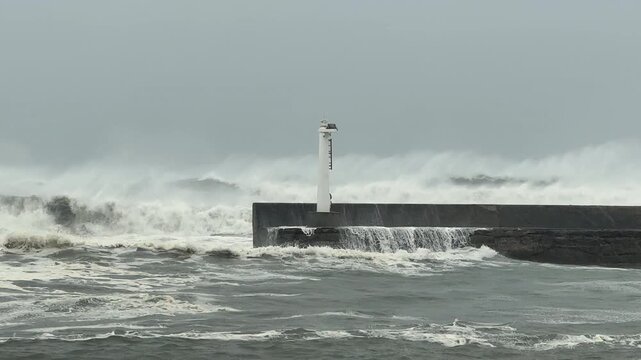 Large Storm Waves From Approaching Hurricane Crash Into Sea Wall