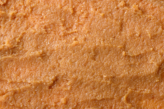 Close-up of miso paste texture background. Traditional fermented soybean seasoning for Japanese cuisine