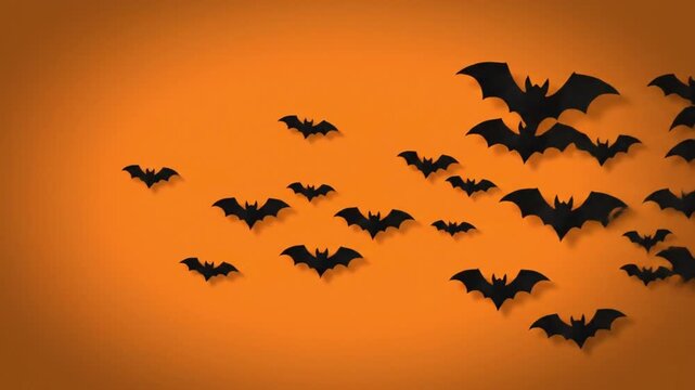 Black paper bats flying across vibrant orange background in this seasonal motion video animation clip design