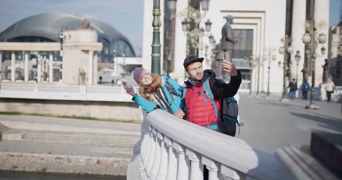Couple Taking Selfies and Browsing Photos While Sightseeing in Skopje, Macedonia