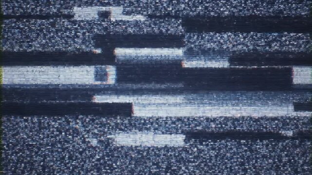 Close-up texture of dark, layered material with a small, bright rectangular anomaly