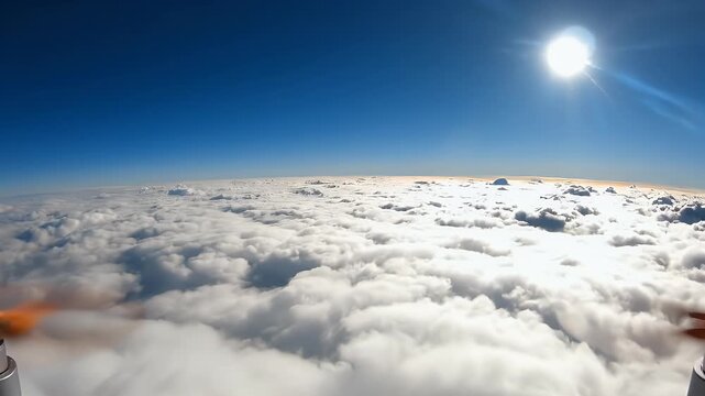Futuristic device emerges from bright, cloudy atmosphere