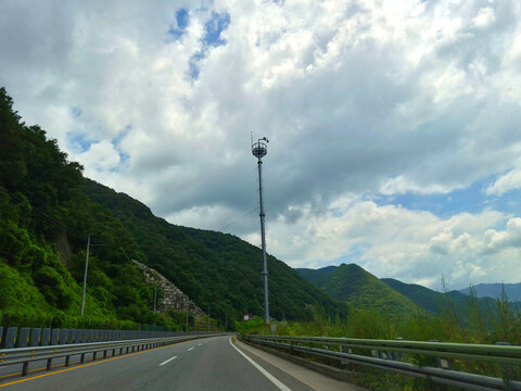 It is a highway with a view of the mountains.