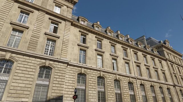 Architectural building facade with many windows and classic design in Paris
