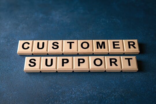 Customer support words spelled out on wooden tiles