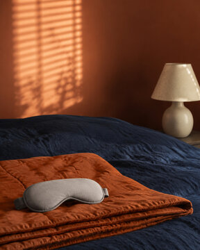 Weighted Sleep Mask on Cozy Bedroom Textiles