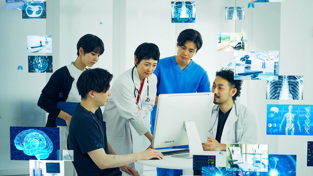 病院でミーティングする医療従事者のグループと医療データ