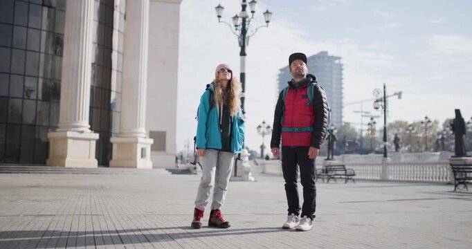 Young Tourist Couple Explore City Center, Sightseeing and Adventure in Bucharest, Romania