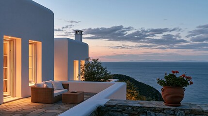 Obraz premium luxury villa terrace overlooking sea at sunset