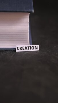 Creation Paper Label Beside Book Representing Innovation and Creative Thinking