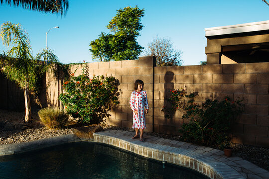 Girl by pool on Christmas morning