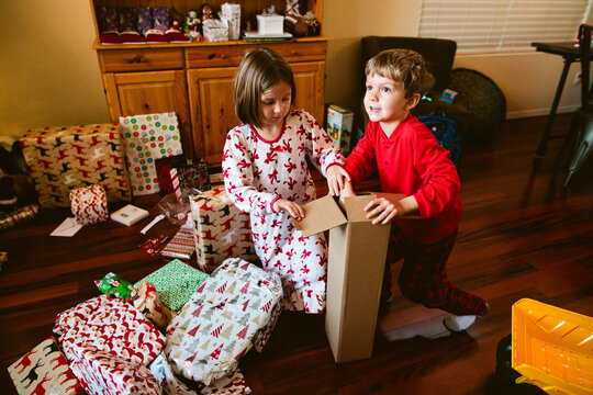 Kids opening presents on Christmas morning