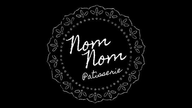 Nom Nom Patisserie circular logo badge with an ornate lace frame is isolated on a solid black background.