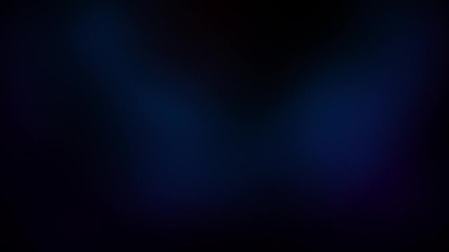 Dark blue abstract background featuring soft glowing light particles and gentle motion design.