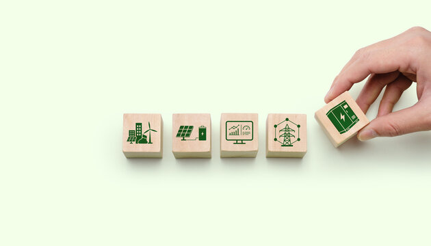 Smart grid and battery storage concept with wooden blocks showing renewable energy city, solar power, analytics dashboard, electric network and power cabinet infrastructure