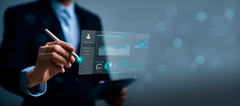 Business analytics dashboard concept with professional using stylus on virtual data interface showing financial charts, performance metrics, growth statistics and strategy insights