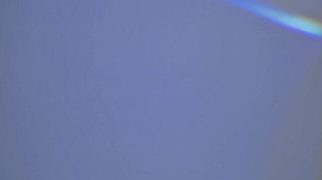 Minimalist video concept with a static, straight-on camera angle capturing a plain gray wall, emphasizing simplicity and calmness.