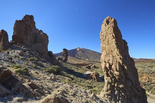 Roques de Garcia, distinctive rock formations in barren landscape in front of a mountain peak and blue sky, Teide National Park, Teide National Park, volcano, volcanism, UNESCO World Heritage Site, Tenerife, Canary Islands, Spain